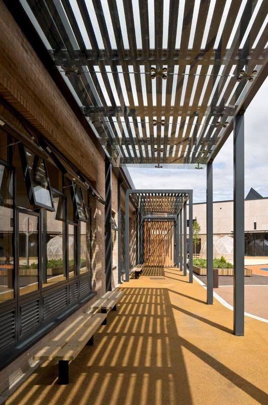 Covered teach space to each classroom and protective courtyard