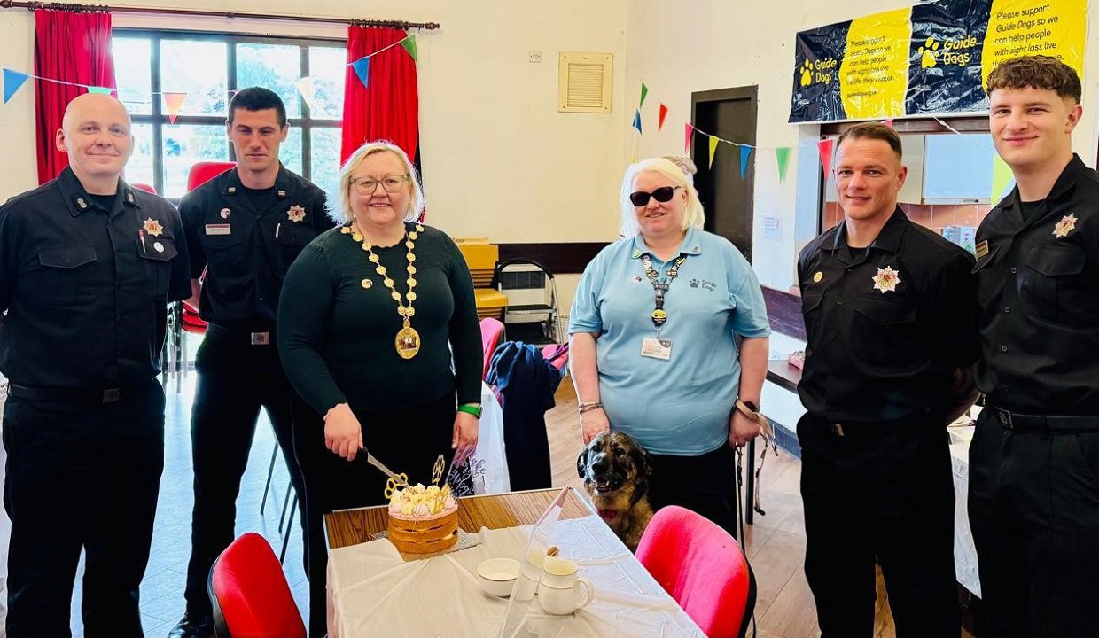 Provost Renwick with firefighter,s Rye and their owner at the fundraiser.