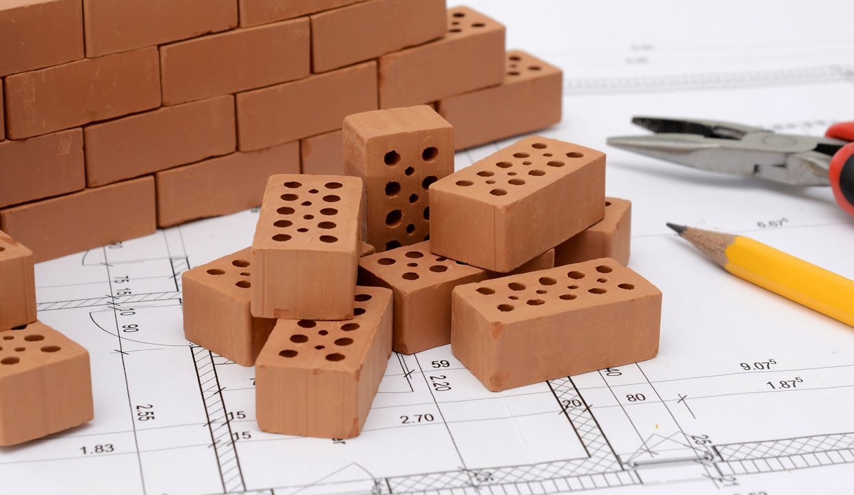 small bricks with a pencil and scissors