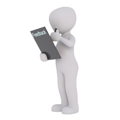 person holding a clipboard with the word 'feedback' written on the back