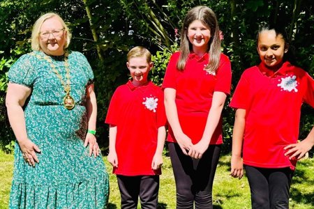 Povost Gillian Renwick with three Bishopbriggs Youth Ambassadors 