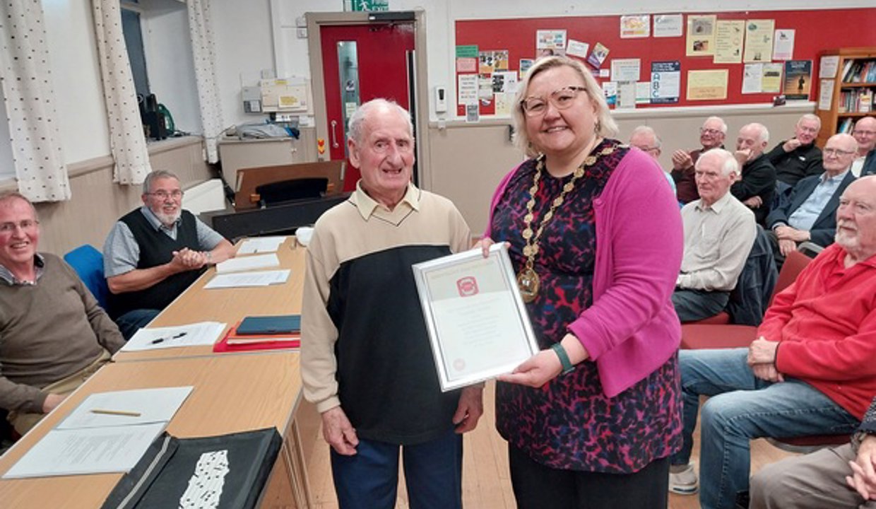 Tommy Reilly receiving award from provost