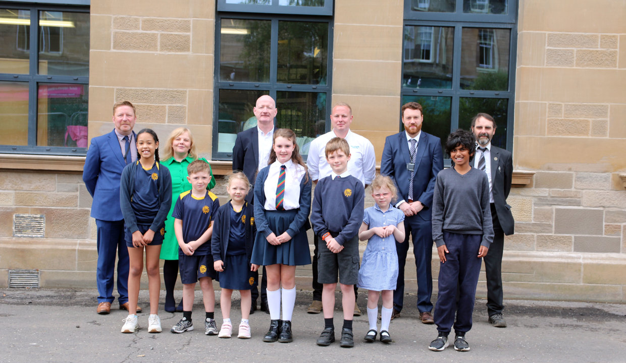 staff and students outside building
