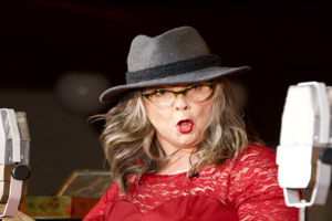 Leonna McGilligan with a microphone either side of her