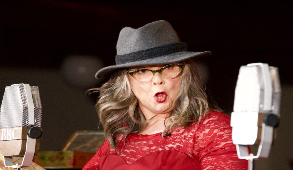 Leonna McGilligan with a microphone either side of her