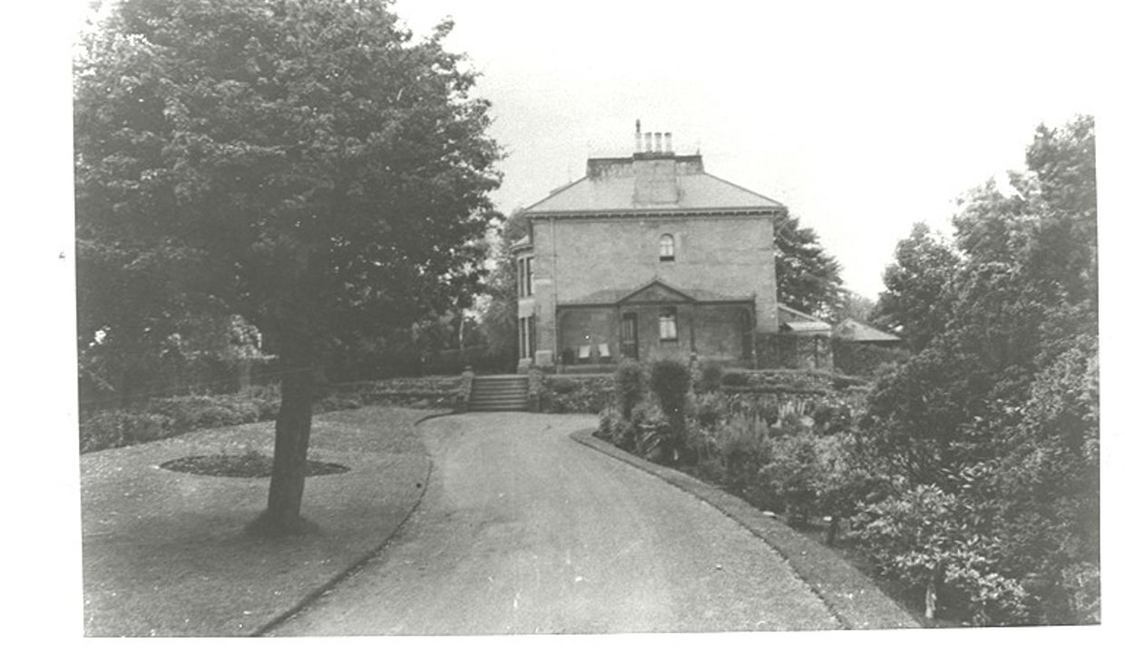 the image depicts the original Brookwood villa -which was built at the end of the nineteenth century – and surrounding gardens.