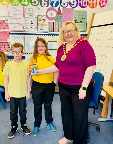 Oliver and Toby with the provost in a classroom