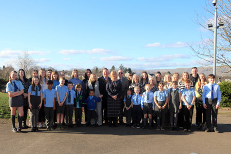 Cllr Williamson (centre) with Head Teacher Greg Caldow, Chief Education Officer Greg Bremner, staff and pupils of Millerseneuk Primary