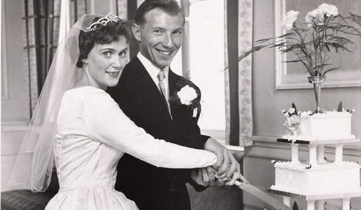 Mr and Mrs Marr cutting their wedding cake in 1959