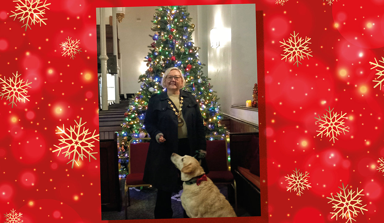 Provost Gillian Renwick standing next to a Christmas tree
