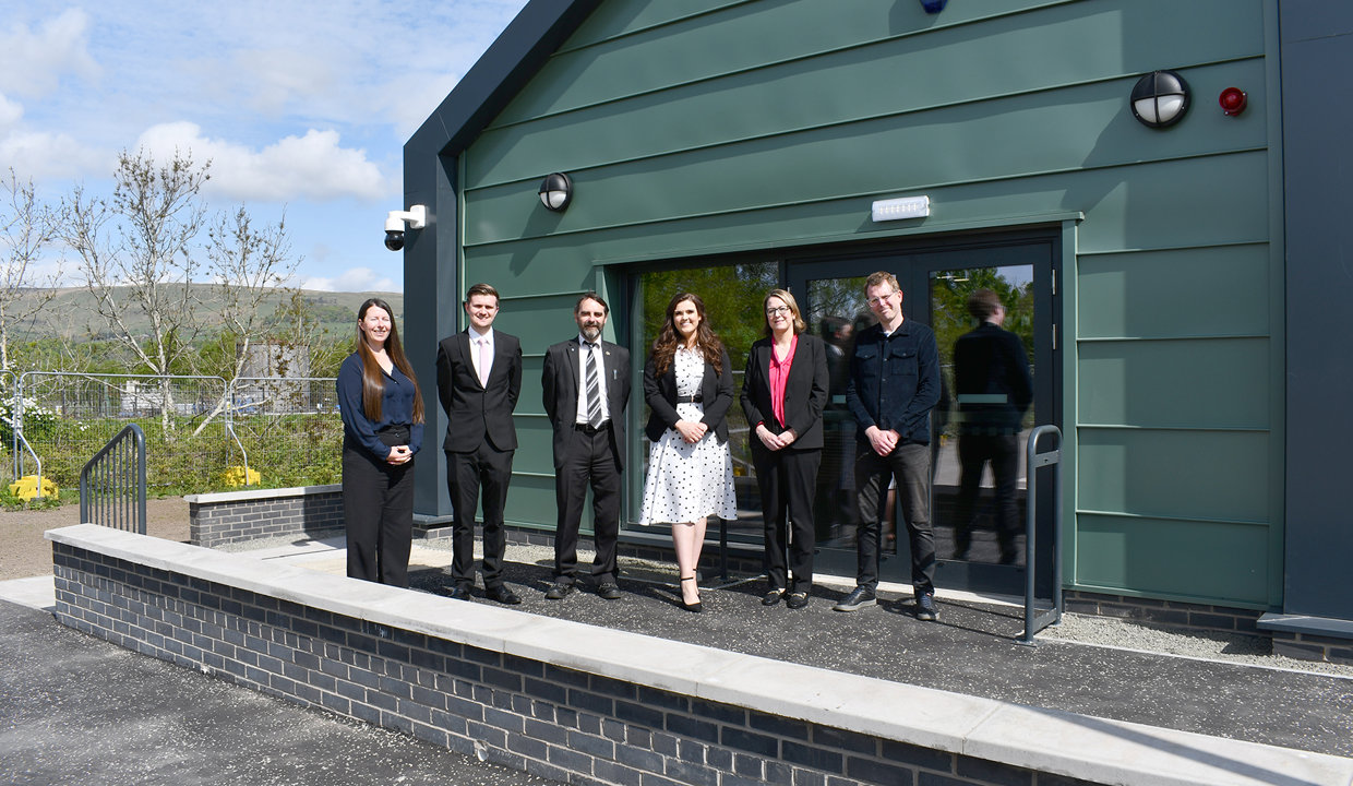  outside the new centre are (from left): Victoria Proven, Site Manager – Morgan Sindall; Aidan Maguire, Project Manager – Major Assets (Council); Councillor Gordan Low – Leader of East Dunbartonshire Council; Emma Flaherty, NEC Supervisor – Doig+Smith; Lillian McDowall, Head of Business Development – SCAPE Scotland; and Alistair Kyle, Team Leader – Regeneration and Town Centres (Council).