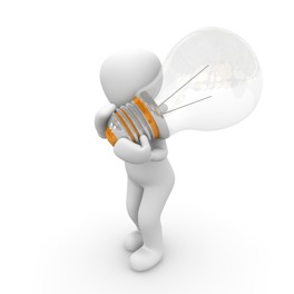 person carrying a large light blub
