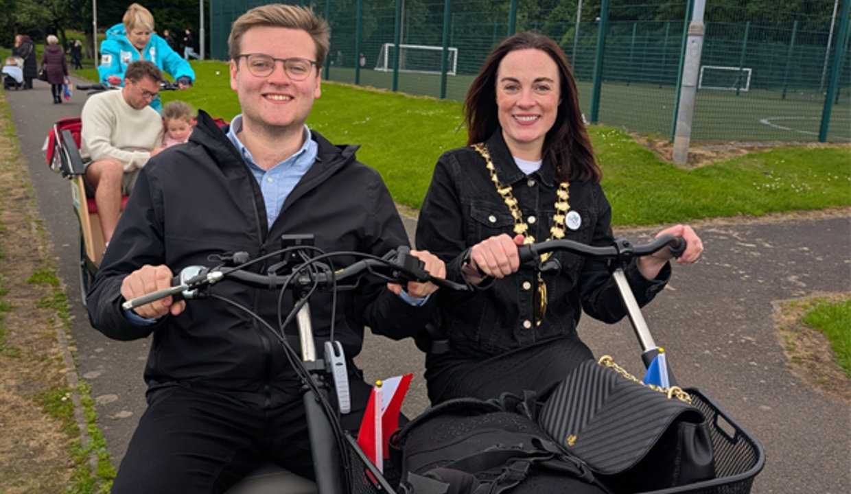 Councillor Aidan Marshall and Depute Provost Colette McDiarmid on bikes at the Kirky Gala