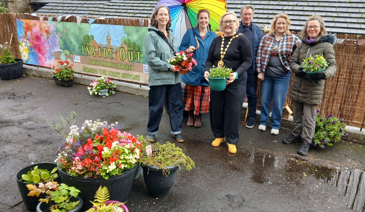 Provost Gillian Renwick recently visited the ‘Inside-Out’ space to pot plants and find out more about the project. She is pictured with Bishopbriggs Library Team Leader Brenda Gardiner and representatives from BetterBriggs, Bishopbriggs Climate Café and Curious in Nature outside the library.