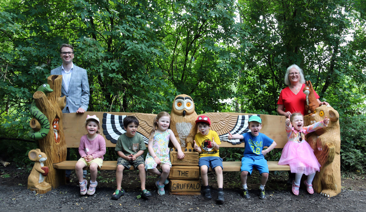 children sitting on a bench