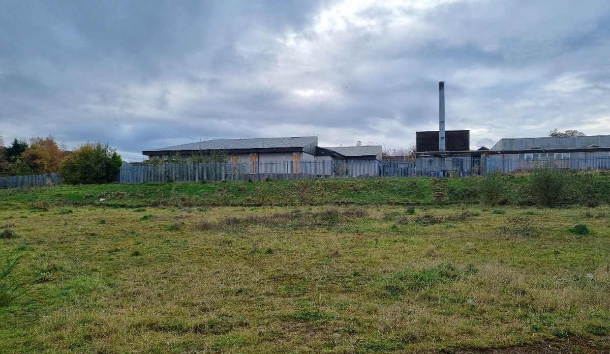 part of the proposed development site with the former Auchinairn Primary School in the backgroun