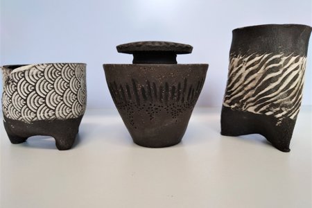 A photo of three items of glazed pottery – part of the exhibits on show at the Auld Kirk