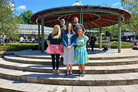 Depute Provost McDiarmid is pictured in front of the bandstand in the walled garden with some of the Mugdock Country Park team