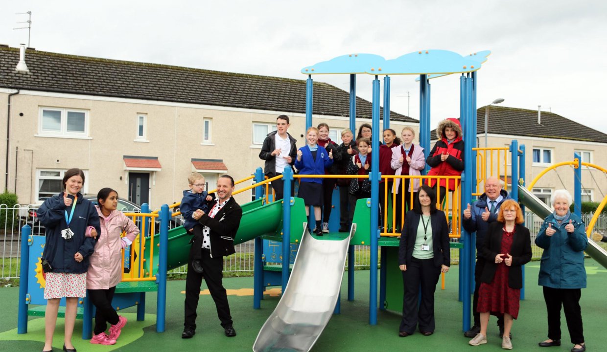 Councillor Pamela Marshall with children and others in the new Waterside play area