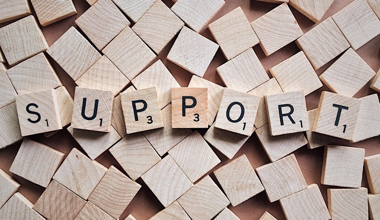 The word 'support' spelled out with lettered blocks
