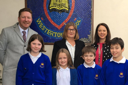 Westerton pupils with councillor, inspector and teacher following positive inspection report
