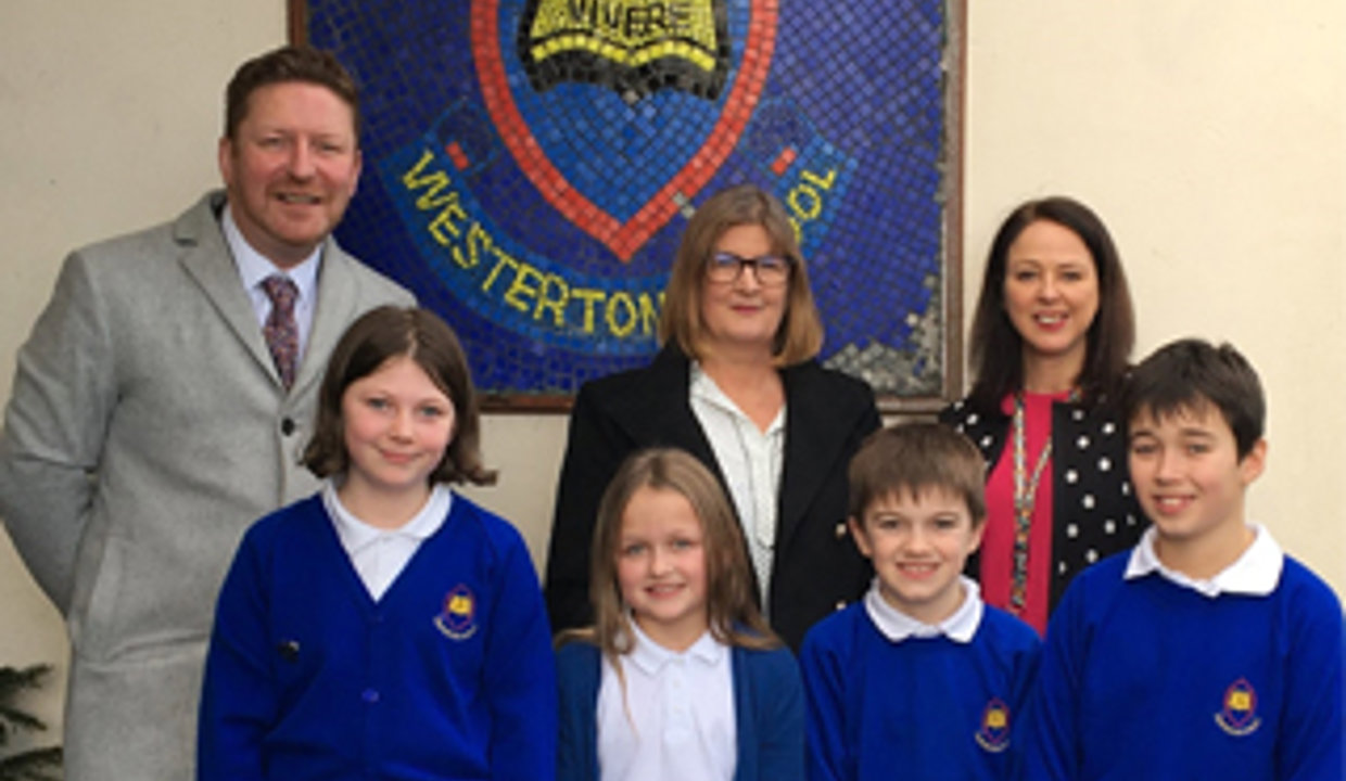 Westerton pupils with councillor, inspector and teacher following positive inspection report