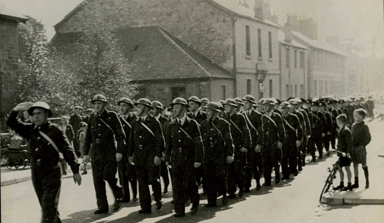 Air Raid Precautions (ARP) wardens in Main Street, Lennoxtown (part of a parade of services) – around 1940
