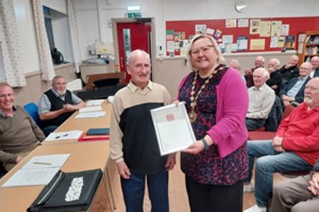 Tommy Reilly receiving award from provost