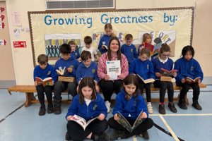 Teacher Ashleigh MacDonald with the book-loving pupils of Craigdhu Primary