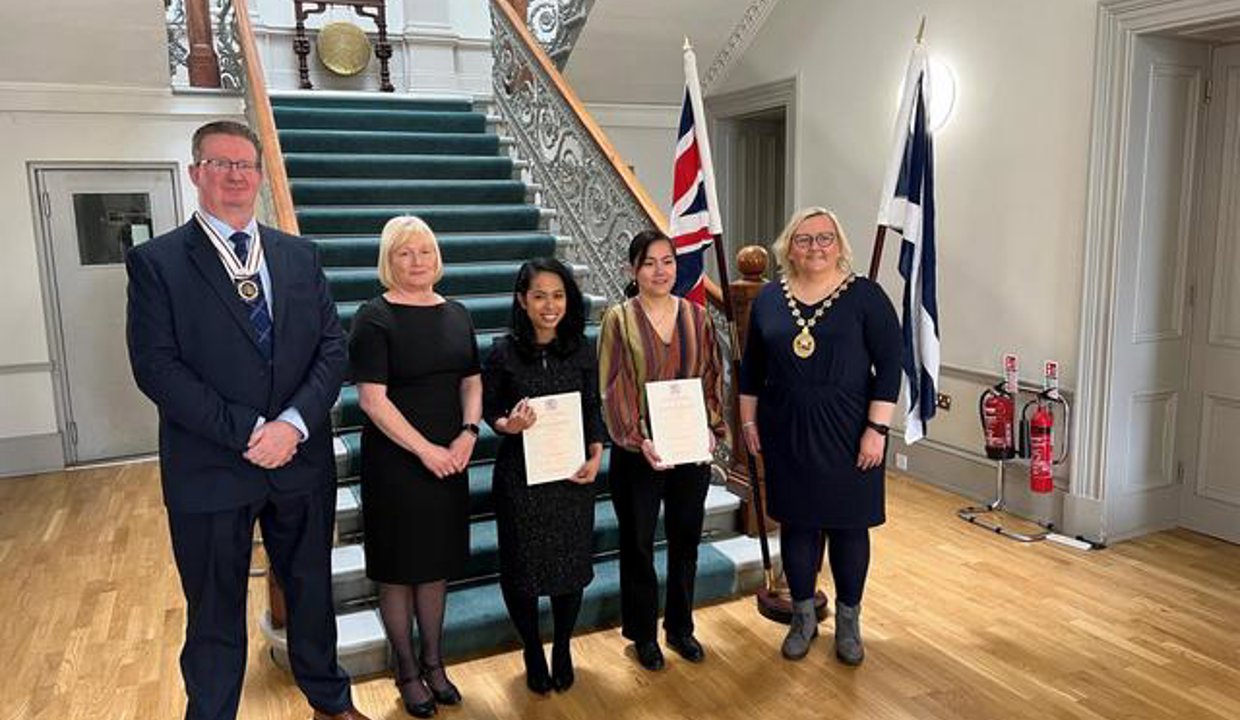 Provost Gillian Renwick with Deputy Lieutenant Mark Billington and new citizens.