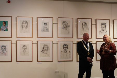 East Dunbartonshire Provost Gillian Renwick and Clackmannanshire Provost Donald Balsillie are pictured in front of paintings at the exhibition