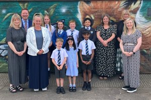 pupils and teachers standing together