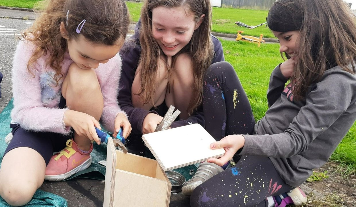 children building birdbox