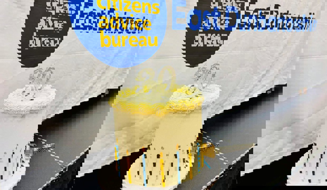 a cream cake with candles the show 30 on the top 