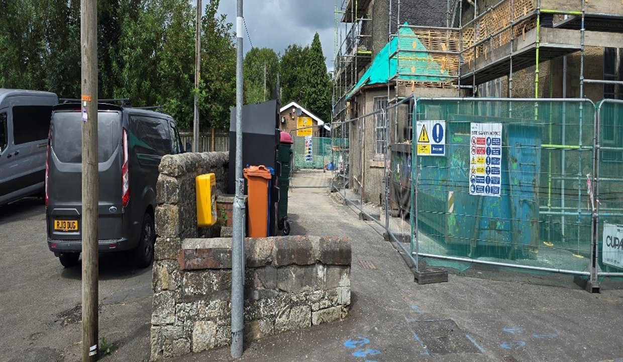 Defibrillator on the left hand wall as entering the site