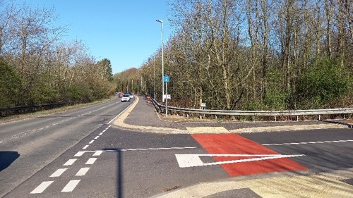 a807 after image showing car travelling along the road approaching a left turn and the new active travel corridor running alongside