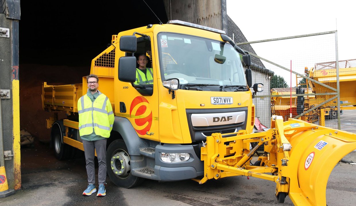 Councillor Paul Ferretti stands to the left hand side of one of the new gritters which are based at Broomhill Depot. In the background is six tonnes of salt inside the massive dome-shaped storage facility.