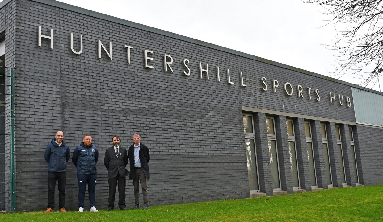 Pictured outside Huntershill Sports Hub are: EDLC Operations Manager Fraser Makeham; Michael Lee, Manager of West Park United FC's men's senior team; Councillor Gordan Low, Leader of the Council; and Councillor Jim Gibbons, Vice Chair of EDLC Trust.