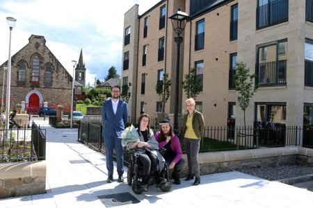 Councillor Paul Ferretti with the first tenants of the new affordable housing on Kerr St, Megan Cassidy and partner Mikey Hanlon