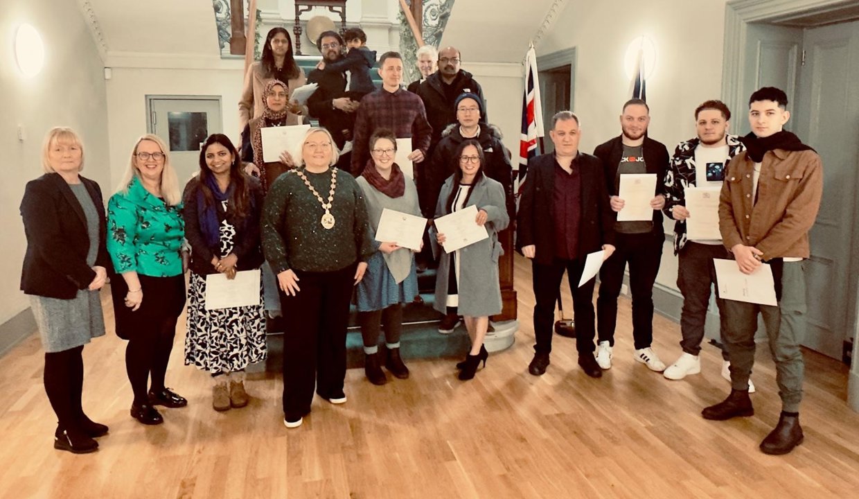 Provost with the residents who have received their UK citizenship.