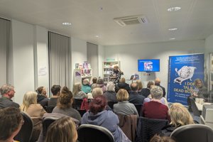 Rhona speaks to an audience