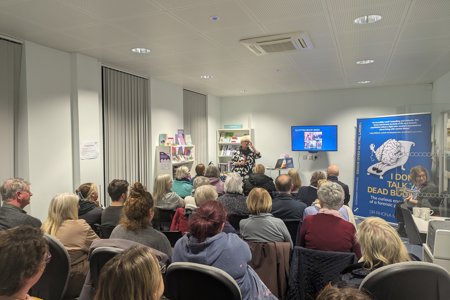 Rhona speaks to an audience