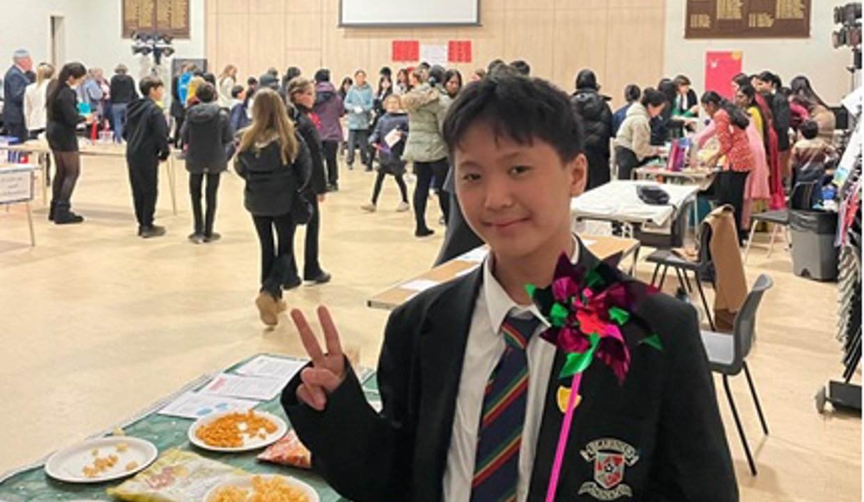 Pupil pictured at an international event at the school learning about other countries and cultures
