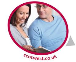 Man and woman looking at laptop