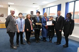Councillor Williamson holds the reading school award and is pictured with pupils and (left to right): School Librarian Susan Wright, Head Teacher Eileen Kennedy and Greg Bremner.