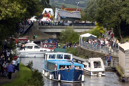 Boats sailing on the canal and people enjoying themselves at the Kirkintilloch canal festival