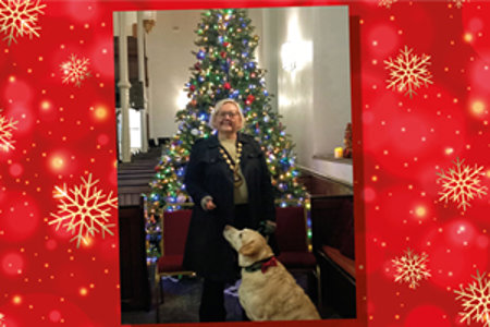 Provost Gillian Renwick standing next to a Christmas tree