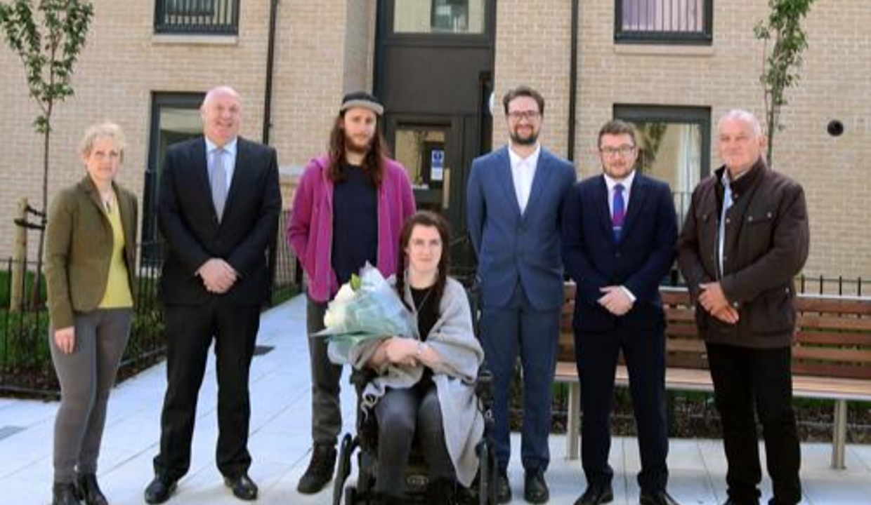 Councillor Paul Ferretti and others with the first tenants of the new affordable housing on Kerr St, Megan Cassidy and partner Mikey Hanlon