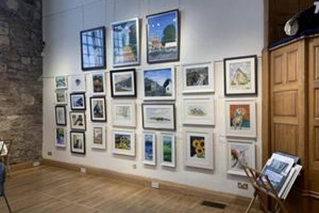 Kelvin Artists exhibition within the Auld Kirk - paintings hanging on wall