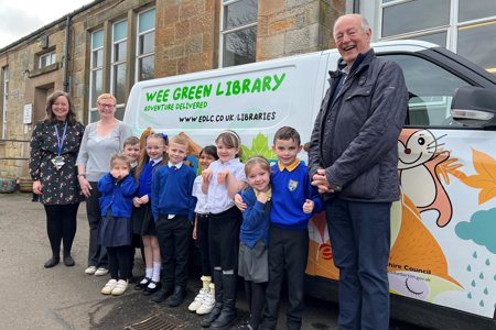 Trust Chair Jim Neill is pictured with pupils at Twechar Primary School, with (from left) teacher Fiona Longstaff and Helen Robertson, Children & Families Co-ordinator for East Dunbartonshire Libraries.